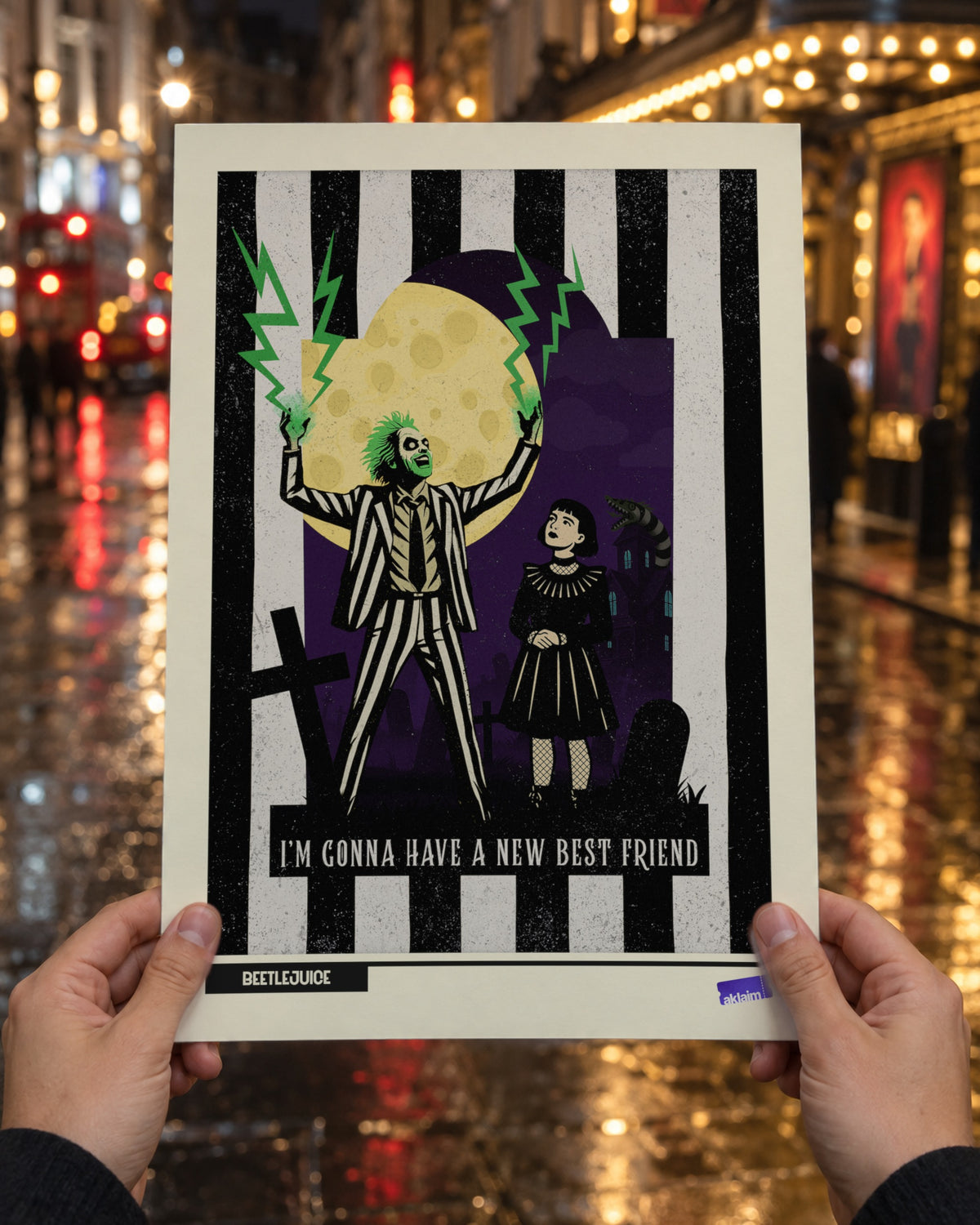 New Best Friend Beetlejuice poster held up in two hands on a rain-wet West End street at night