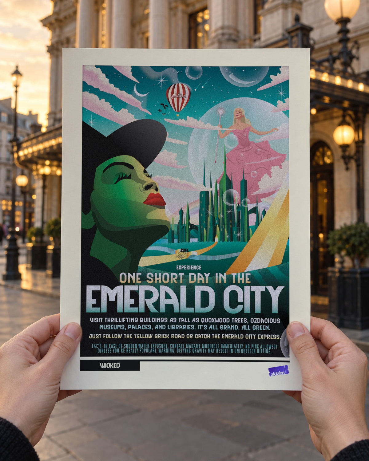 One Short Day Wicked poster held up in two hands outside a London theatre at golden hour