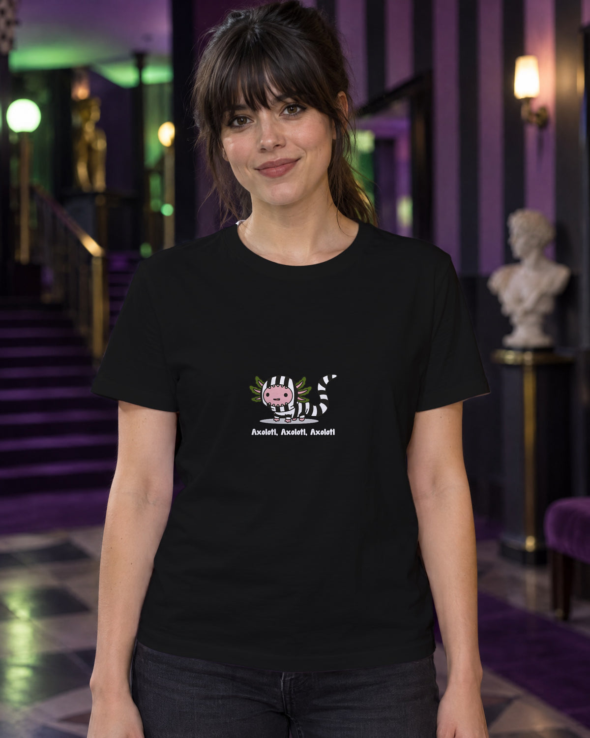 Axolotl Beetlejuice t-shirt in Black, worn in a black-and-purple striped theatre foyer