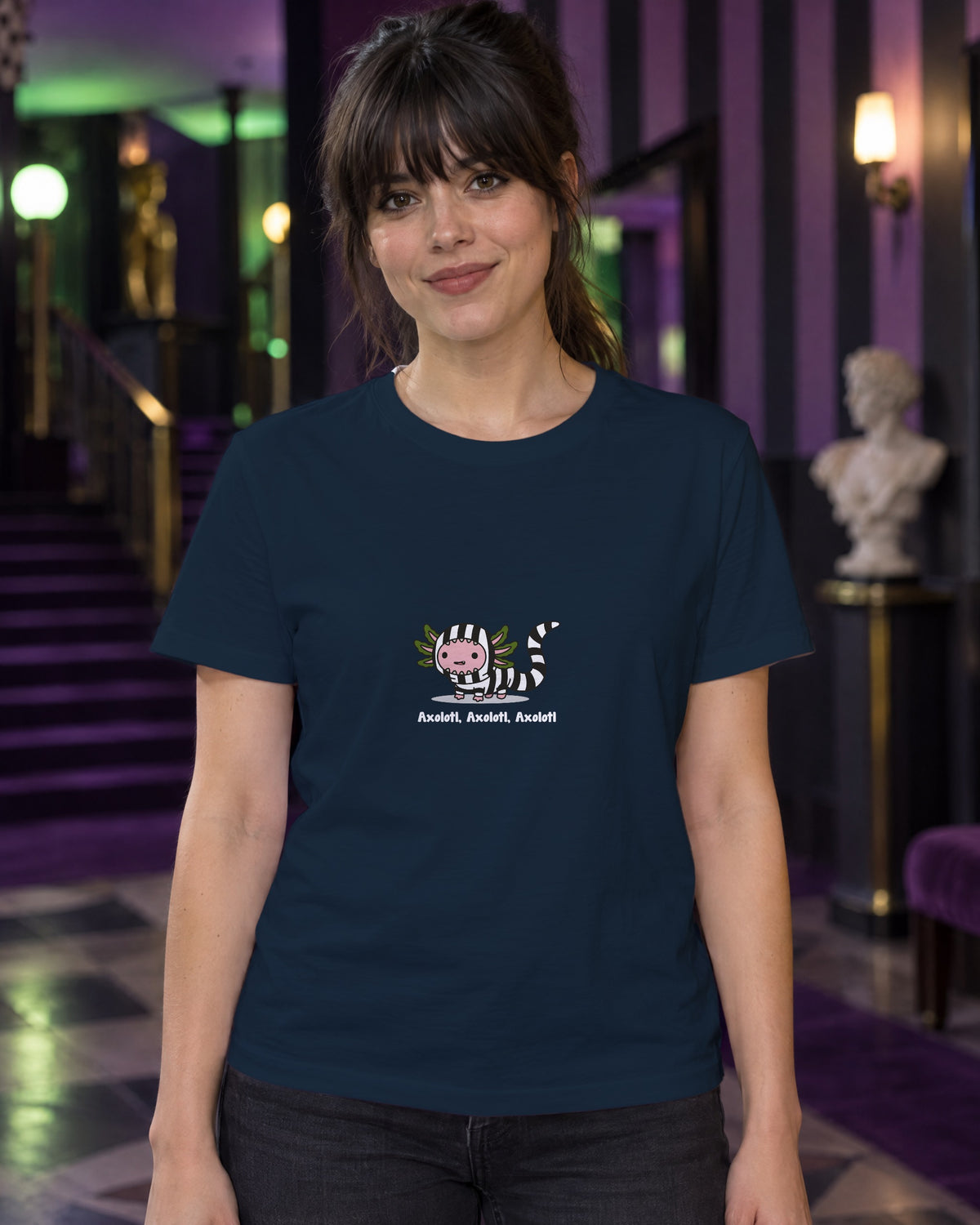 Axolotl Beetlejuice t-shirt in French Navy, worn in a black-and-purple striped theatre foyer