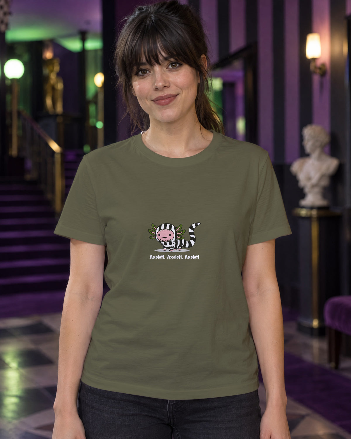 Axolotl Beetlejuice t-shirt in Khaki, worn in a black-and-purple striped theatre foyer