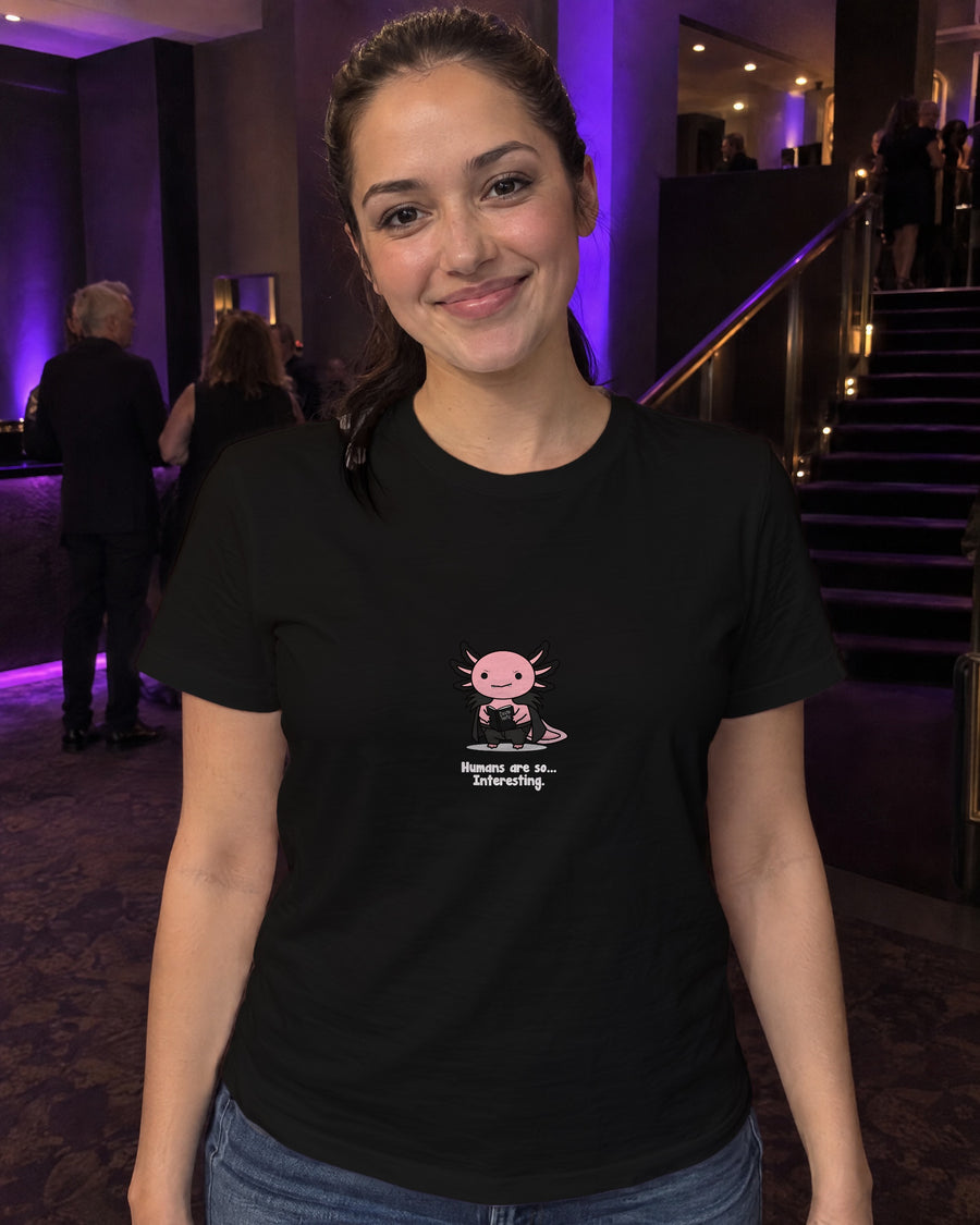 Humans Are So Interesting t-shirt in Black, worn in a theatre foyer
